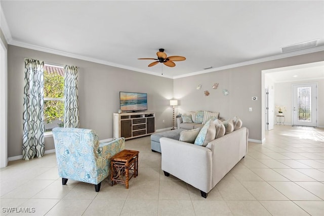 living room with crown molding, a wealth of natural light, and light tile patterned flooring