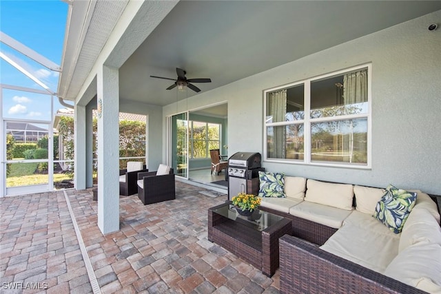 view of patio featuring ceiling fan, outdoor lounge area, a lanai, and area for grilling