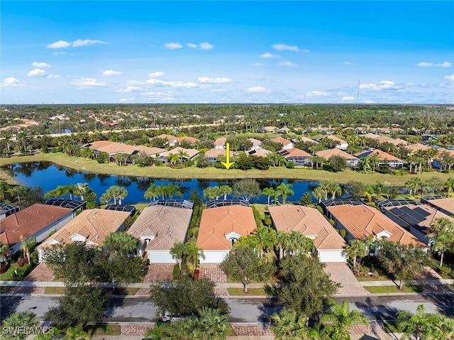 birds eye view of property featuring a water view and a residential view