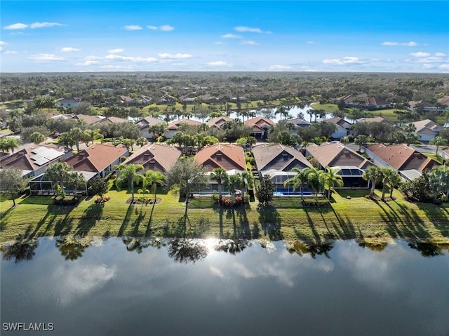 bird's eye view featuring a water view and a residential view