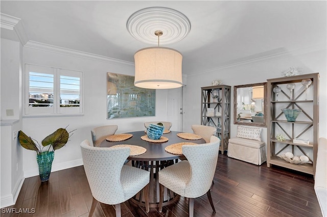 dining room with crown molding and dark wood-type flooring