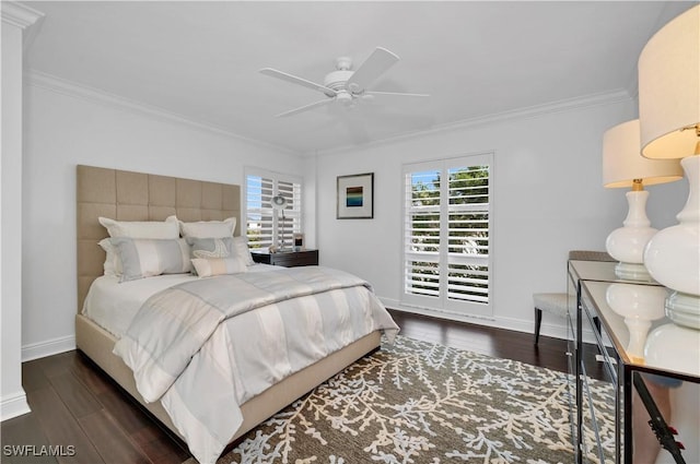 bedroom featuring ornamental molding, dark wood-type flooring, and ceiling fan