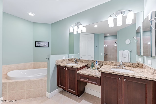 bathroom with vanity, tile patterned floors, and separate shower and tub