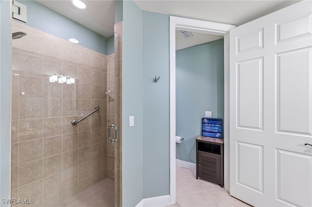 bathroom featuring tile patterned floors and an enclosed shower