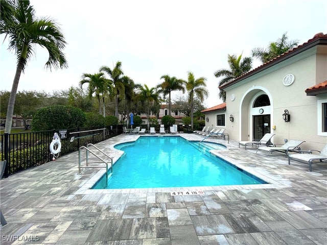 view of swimming pool featuring a patio