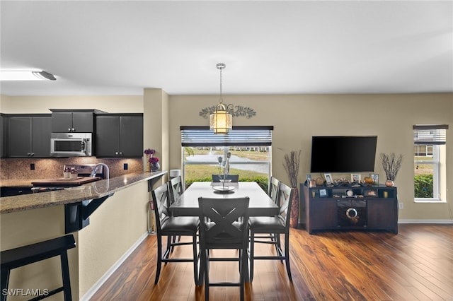 dining area with dark wood-type flooring