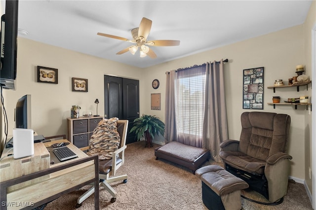 carpeted office featuring ceiling fan