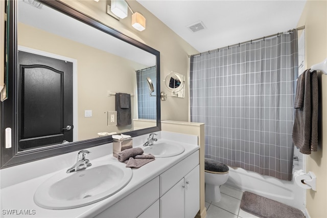 full bathroom featuring shower / bath combination with curtain, vanity, tile patterned floors, and toilet