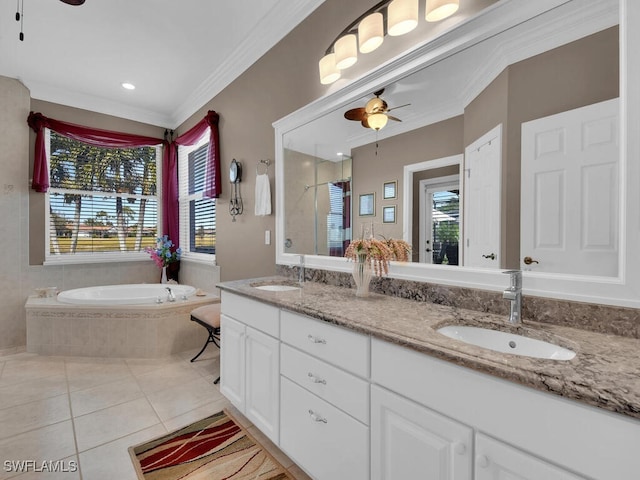 bathroom featuring crown molding, ceiling fan, a relaxing tiled tub, vanity, and tile patterned floors