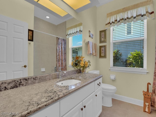 bathroom with vanity, toilet, curtained shower, and tile patterned flooring