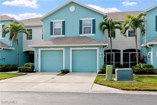 view of front of home featuring a garage and a front yard