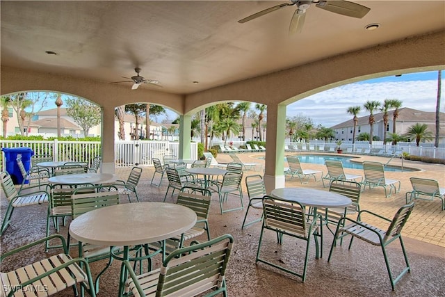 view of patio / terrace featuring a community pool and ceiling fan