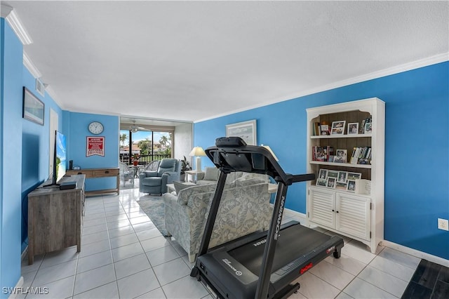 workout area featuring ornamental molding and light tile patterned floors