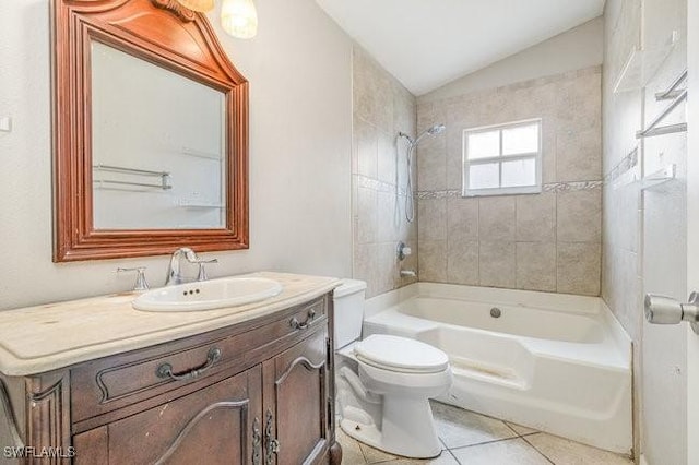 full bathroom with tiled shower / bath combo, lofted ceiling, tile patterned floors, vanity, and toilet