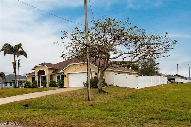 view of front of home featuring a garage and a front yard