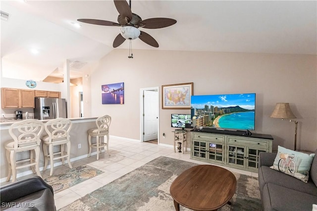 living room featuring lofted ceiling, ceiling fan, and light tile patterned flooring