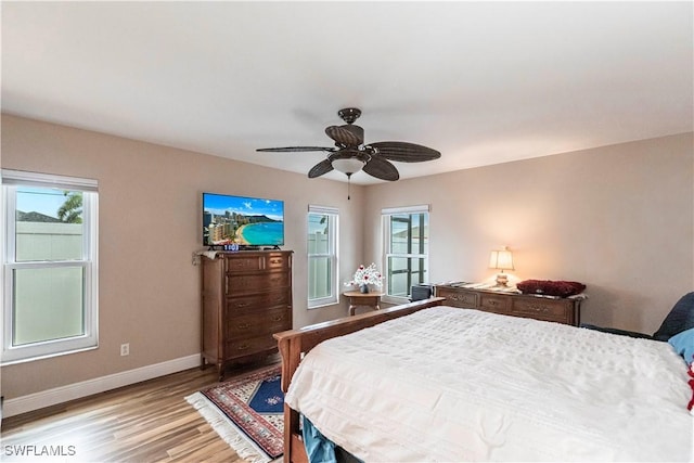 bedroom featuring light wood-type flooring and ceiling fan