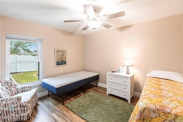 bedroom featuring dark hardwood / wood-style floors and ceiling fan