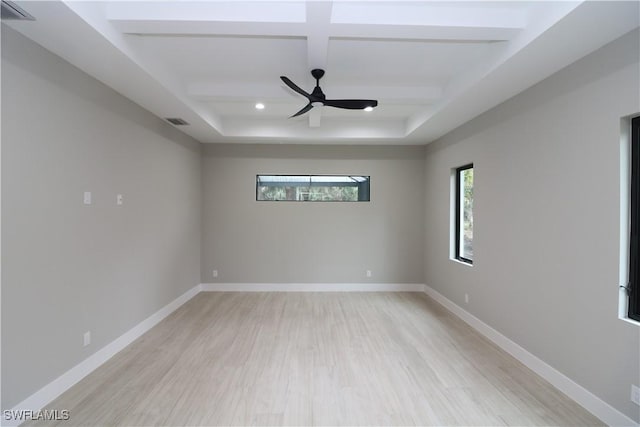 unfurnished room with beamed ceiling, ceiling fan, coffered ceiling, and light wood-type flooring