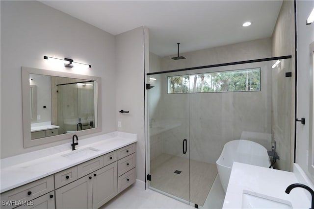 bathroom featuring vanity, separate shower and tub, and tile patterned floors