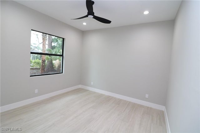 unfurnished room with ceiling fan and light hardwood / wood-style floors