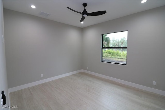 empty room featuring ceiling fan and light hardwood / wood-style flooring