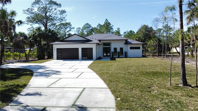 view of front of house featuring a garage and a front yard