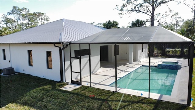 back of house featuring a yard and a patio area