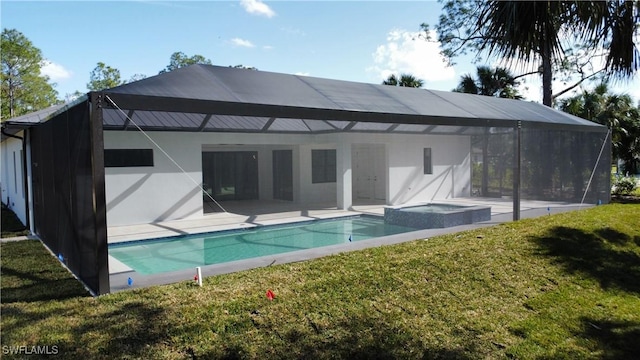 back of house featuring a pool with hot tub, a yard, a lanai, and a patio area