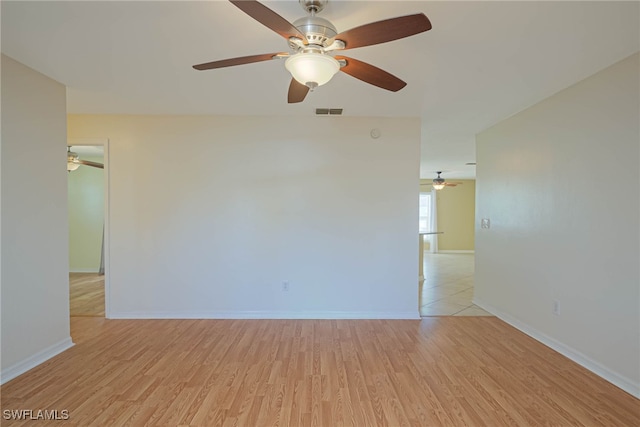 unfurnished room with light hardwood / wood-style floors