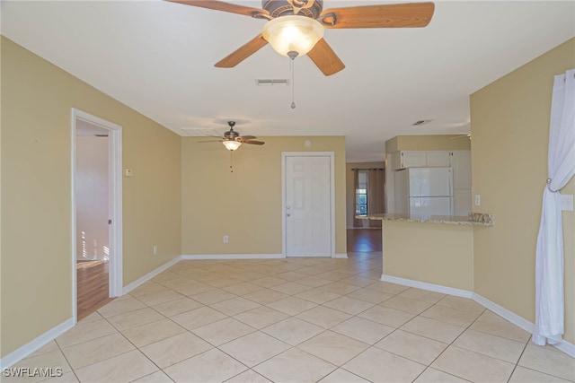 spare room featuring light tile patterned floors