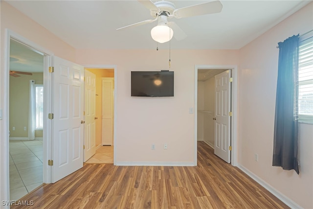 unfurnished bedroom featuring hardwood / wood-style flooring and ceiling fan