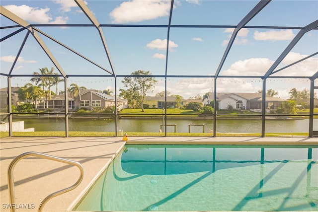 view of pool featuring a water view and a lanai