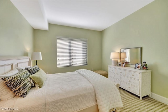 1115 Central Ave Unit 457, Naples, FL 34102 - bedroom featuring light colored carpet, baseboards, and multiple windows
