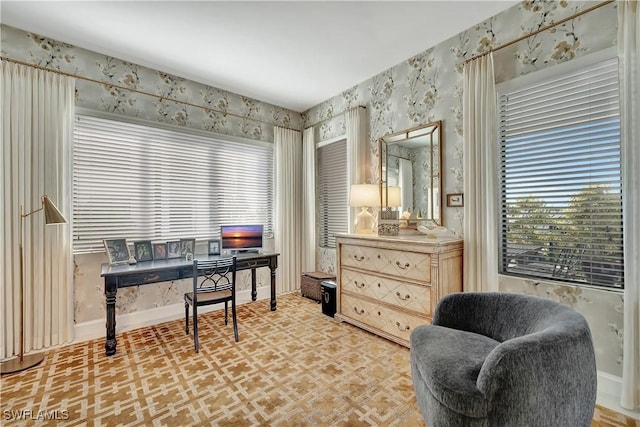 1115 Central Ave Unit 457, Naples, FL 34102 - home office with light floors, baseboards, and wallpapered walls
