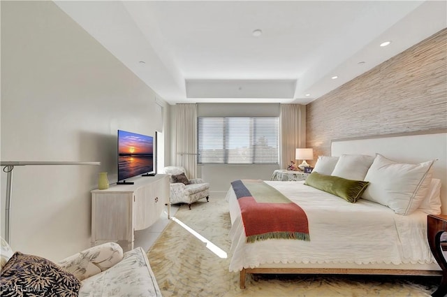 bedroom featuring a raised ceiling