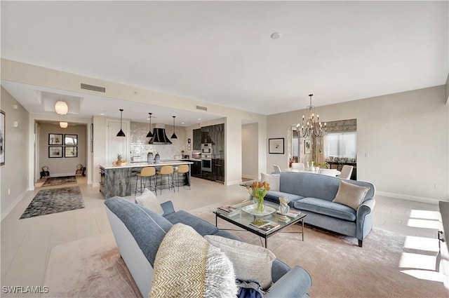 living room featuring a chandelier