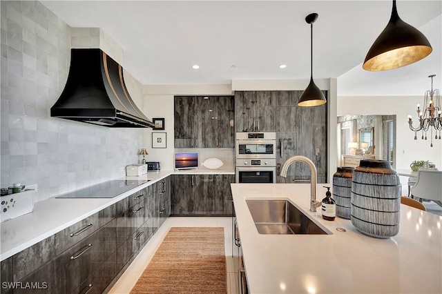 kitchen featuring sink, backsplash, black electric stovetop, dark brown cabinetry, and custom range hood