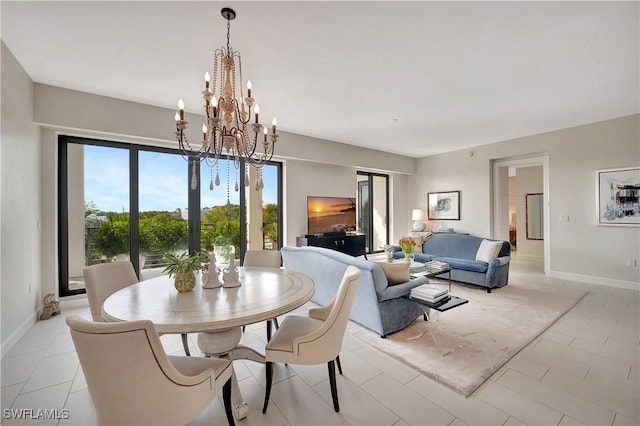 dining area with light tile patterned floors and a notable chandelier