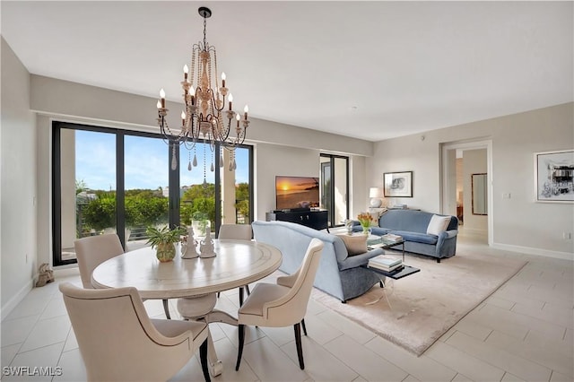 1115 Central Ave Unit 457, Naples, FL 34102 - dining area featuring baseboards and a notable chandelier
