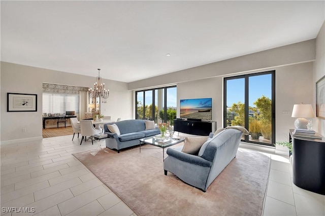 living room featuring a wealth of natural light and a chandelier