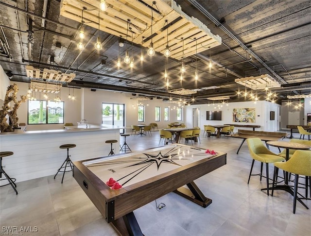 game room featuring concrete flooring