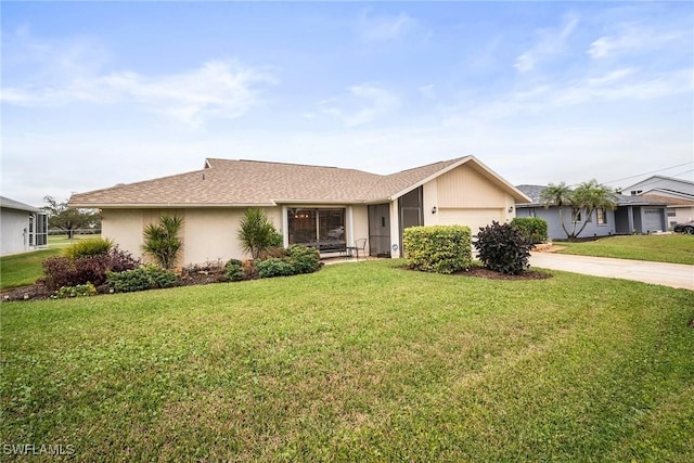 ranch-style house with a garage and a front lawn