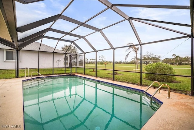 view of pool with a lanai, a patio area, and a lawn