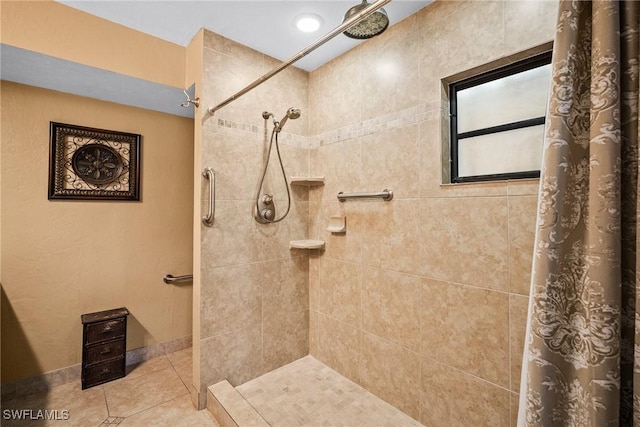 bathroom featuring walk in shower and tile patterned floors