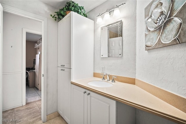 bathroom with tile patterned flooring and vanity