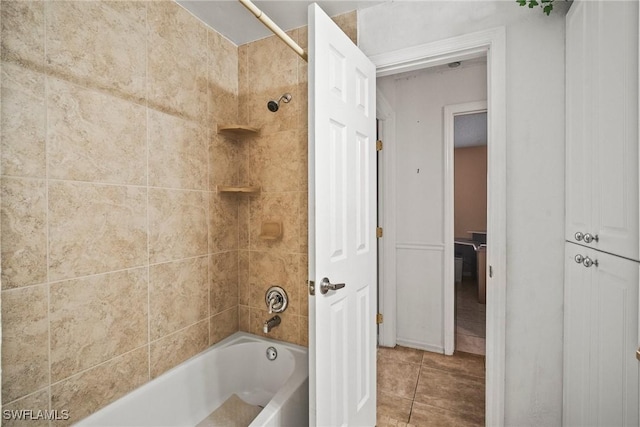 bathroom with tile patterned flooring and tiled shower / bath combo