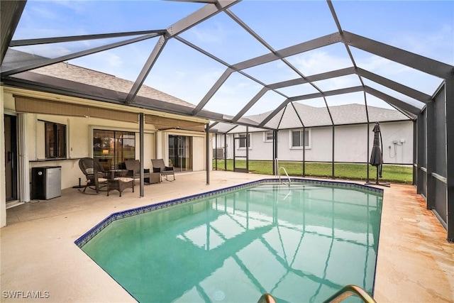 view of swimming pool featuring an outdoor living space, a lanai, and a patio area