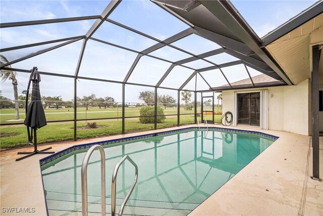 view of swimming pool featuring a yard, a lanai, and a patio area