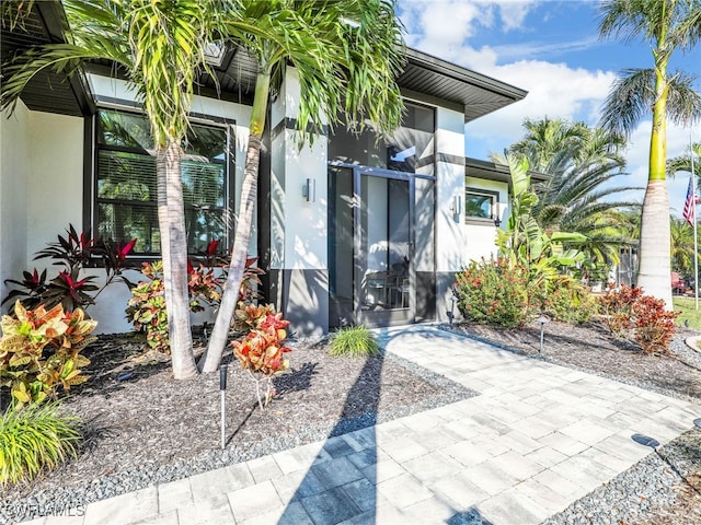 doorway to property with a patio